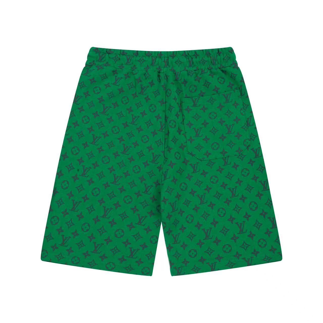 Green all-over logo shorts